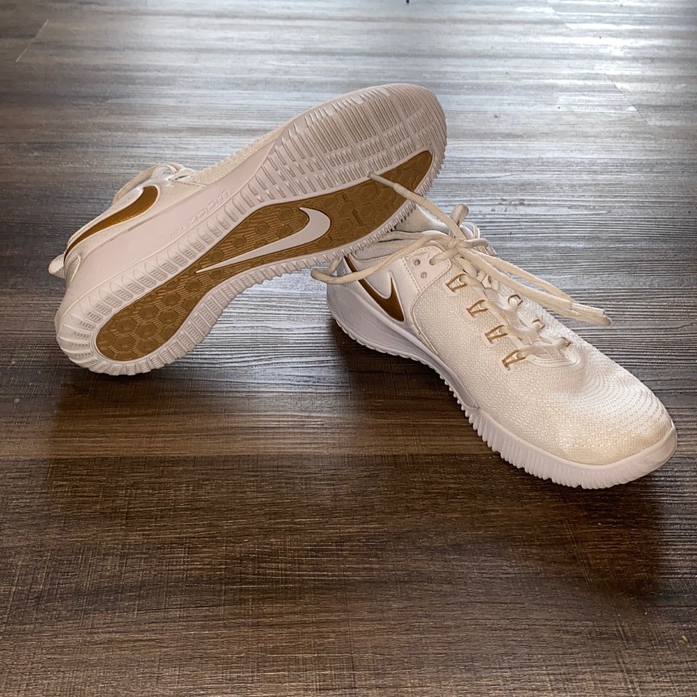 Nike women’s size 8 Gold and White volleyball shoes. Used 1 season.
